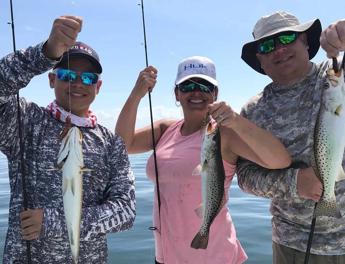 Family fishing on a fishing charter in Crystal River, FL with well-maintained fishing equipment.