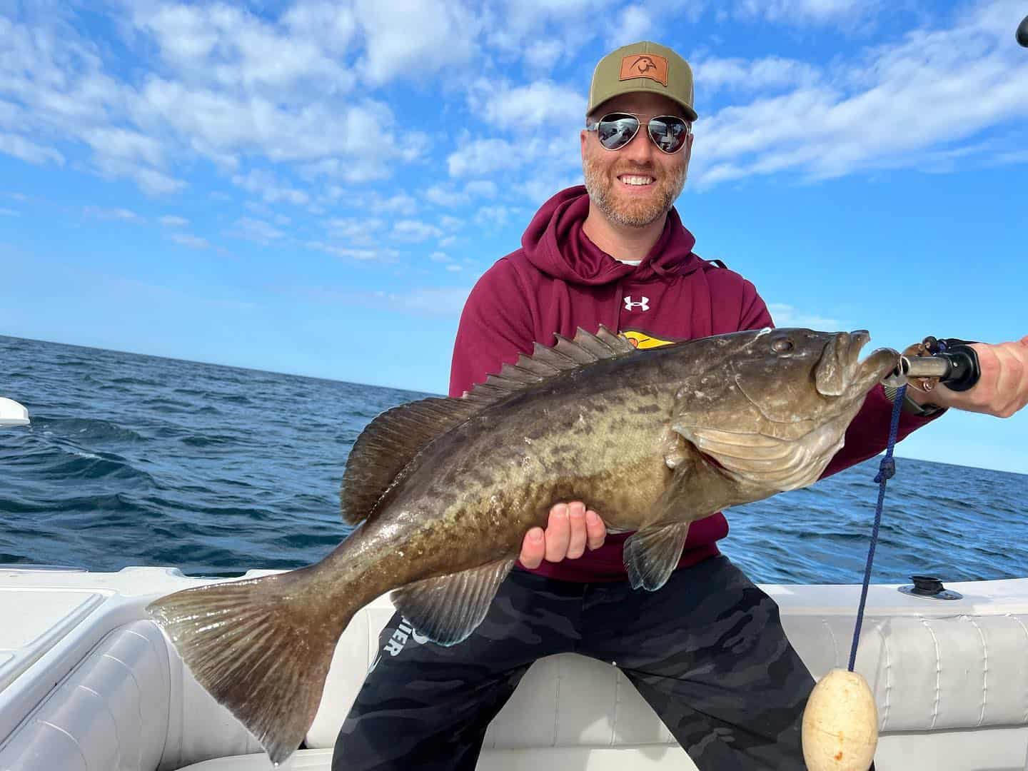 Man holding up a fish he caught while out on the water with a Salt River Outfitters fishing charter in Crystal River, FL.
