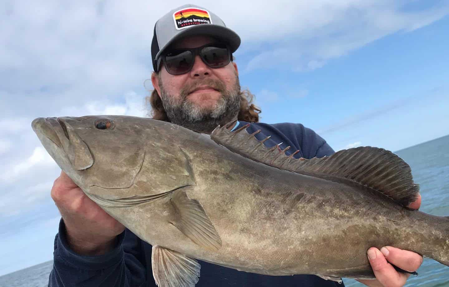 Man holding up a gag grouper caught while on a fishing charter with Salt River Outfitters in Crystal River, FL.